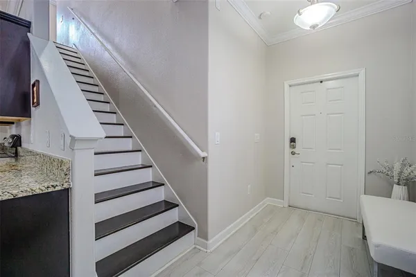 a bathroom with a sink a large mirror and a bathtub