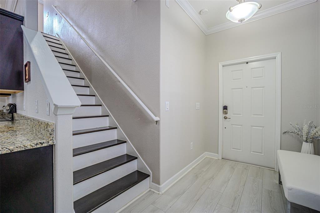1762 Hadden Hall Place Trinity, FL 34655 - Photo 21 of 39 a view of a hallway with wooden floor and entryway
