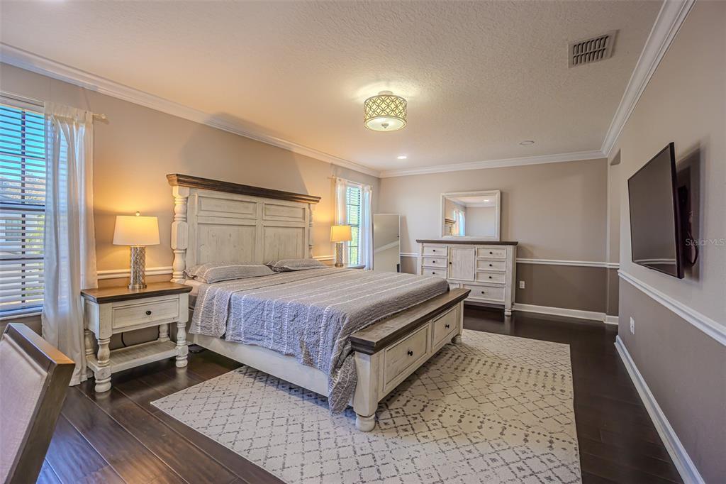 1762 Hadden Hall Place Trinity, FL 34655 - Photo 24 of 39 a bed room with a bed and a television