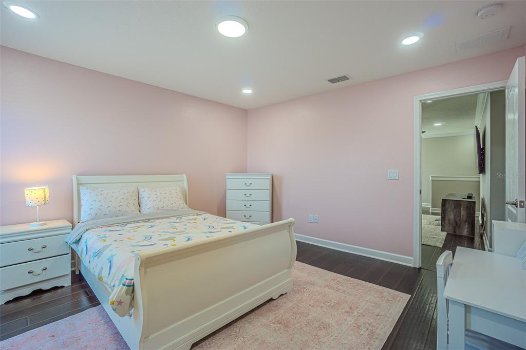 1762 Hadden Hall Place Trinity, FL 34655 - Photo 32 of 39 a bedroom with a bed and a dresser