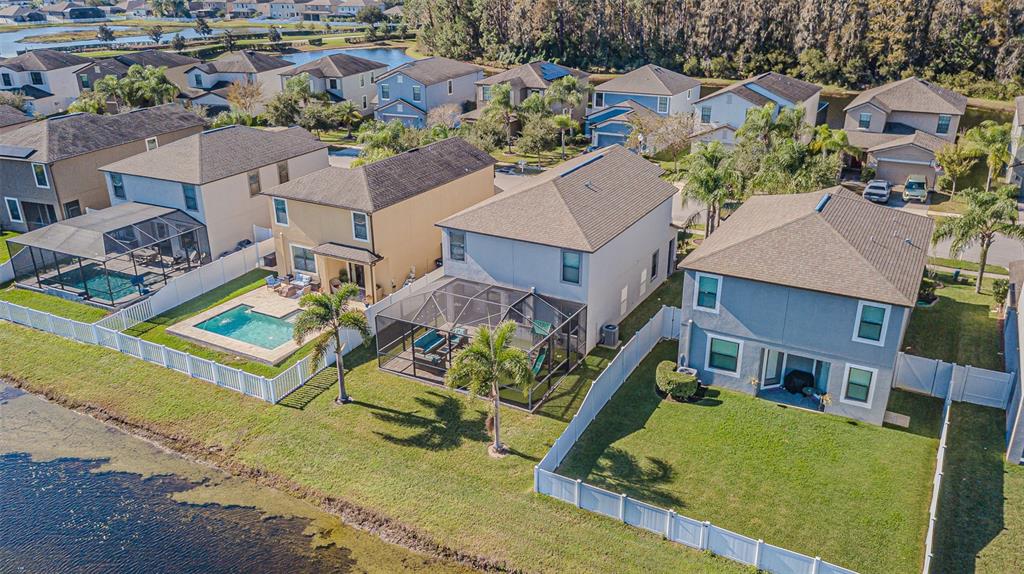 1762 Hadden Hall Place Trinity, FL 34655 - Photo 7 of 39 an aerial view of a house with a garden and swimming pool