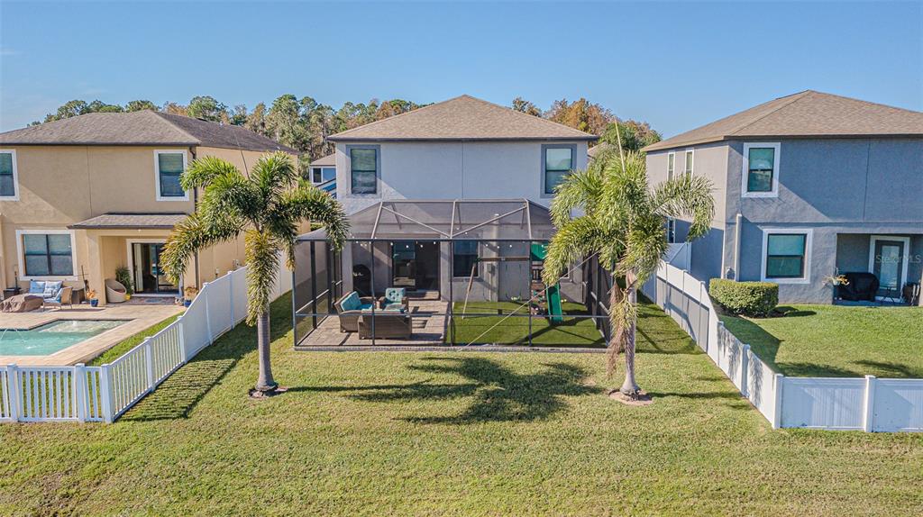 1762 Hadden Hall Place Trinity, FL 34655 - Photo 9 of 39 a view of a house with backyard porch and sitting area