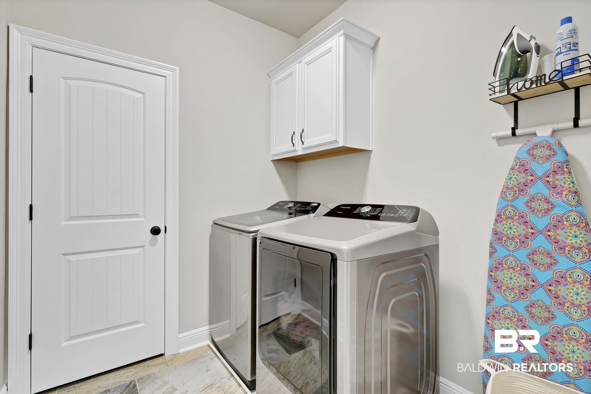 11247 Thistledown Loop Spanish Fort, AL 36527 - Photo 41 of 72 Laundry room featuring cabinet space, baseboards, and washer and clothes dryer