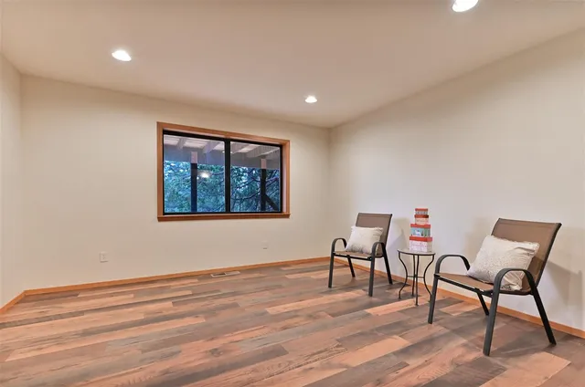 a view of a livingroom with furniture and wooden floor