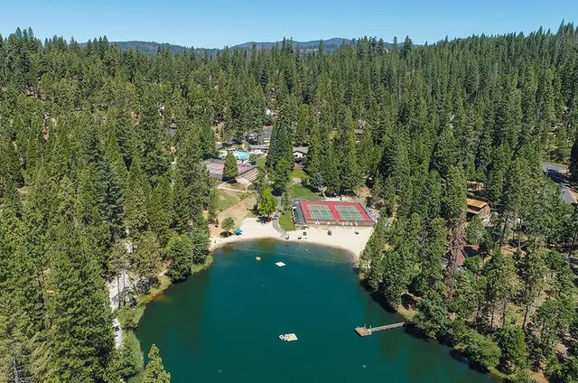 a aerial view of a house with lots of green space
