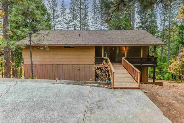 an outdoor view of house with garage