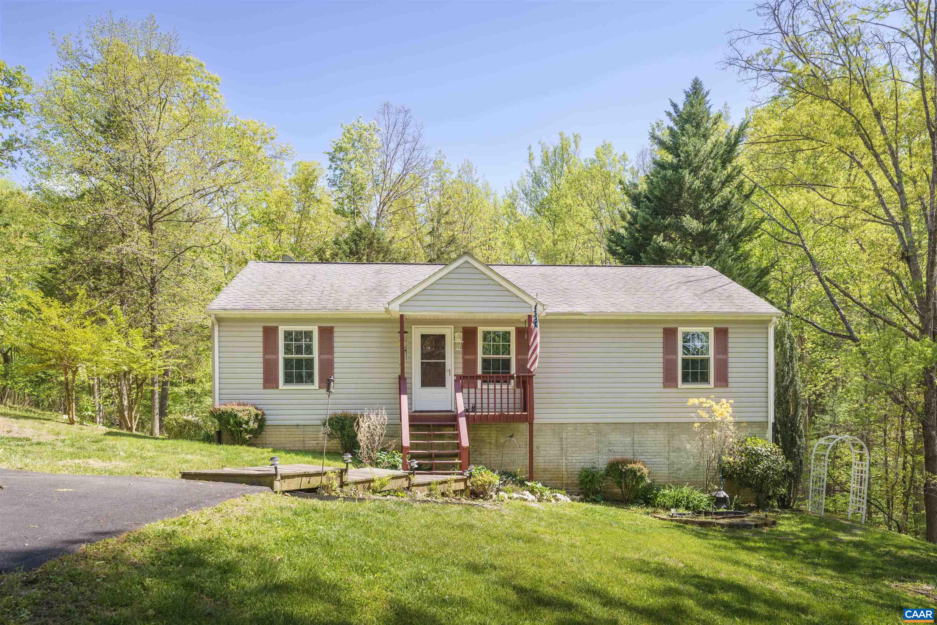 751 Jonquil Road Ruckersville, VA 22968 - Photo 1 of 35 a view of a house with a yard and a garden