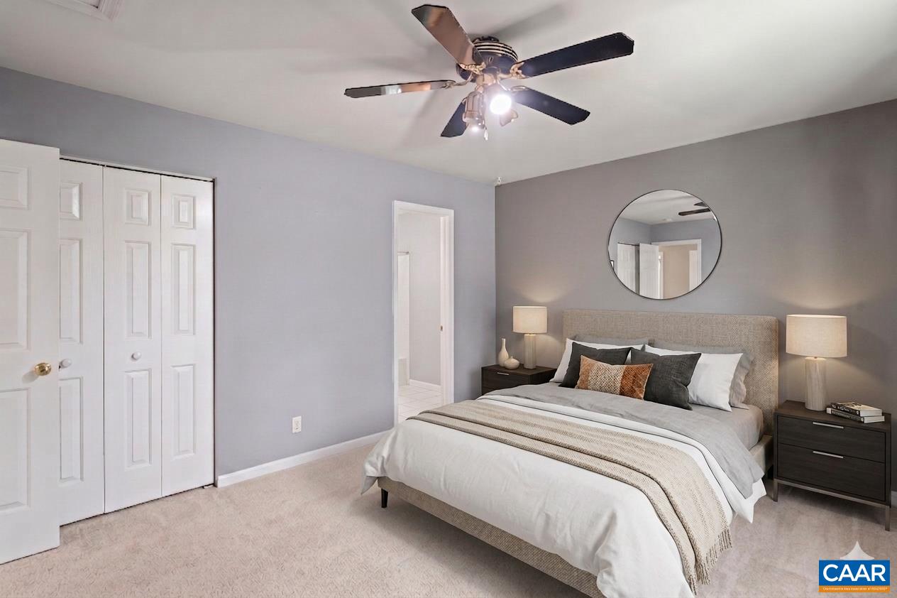 751 Jonquil Road Ruckersville, VA 22968 - Photo 22 of 35 a bedroom with a bed and a chandelier