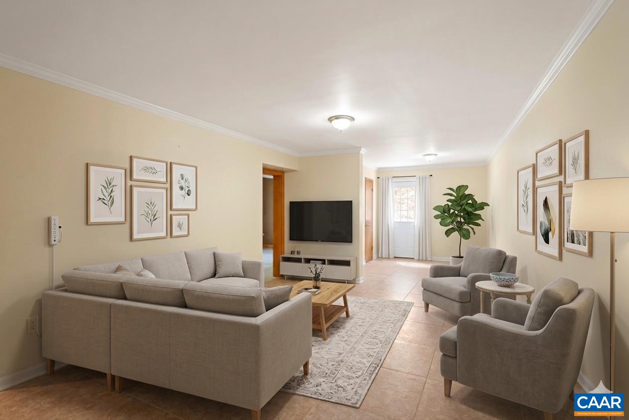 751 Jonquil Road Ruckersville, VA 22968 - Photo 27 of 35 a living room with furniture and a flat screen tv