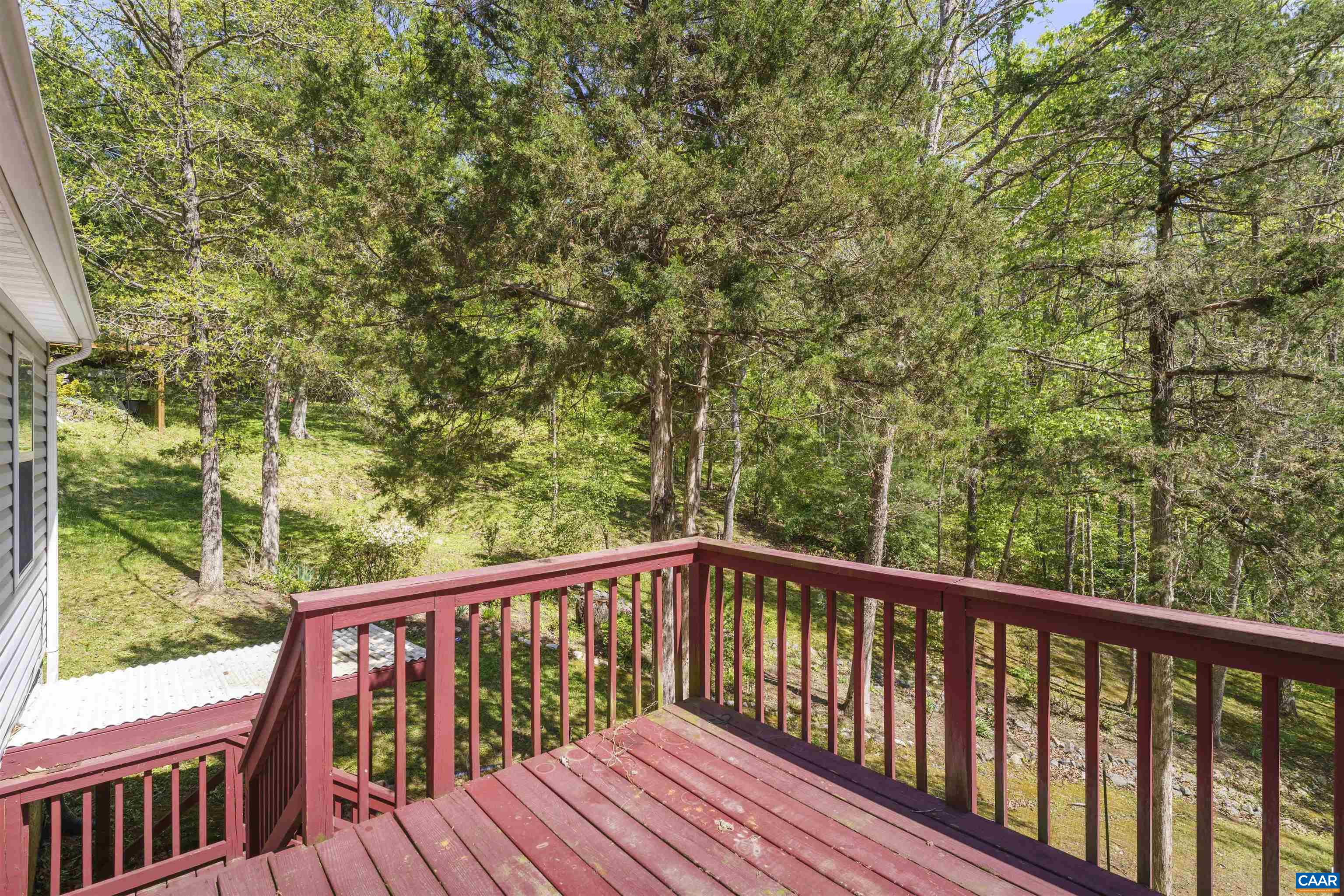 751 Jonquil Road Ruckersville, VA 22968 - Photo 5 of 35 a view of balcony with wooden floor and outdoor space