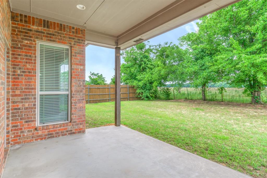 1852 Meadowview Canton, TX 75103 - Photo 26 of 28 a view of a house with backyard and a tree