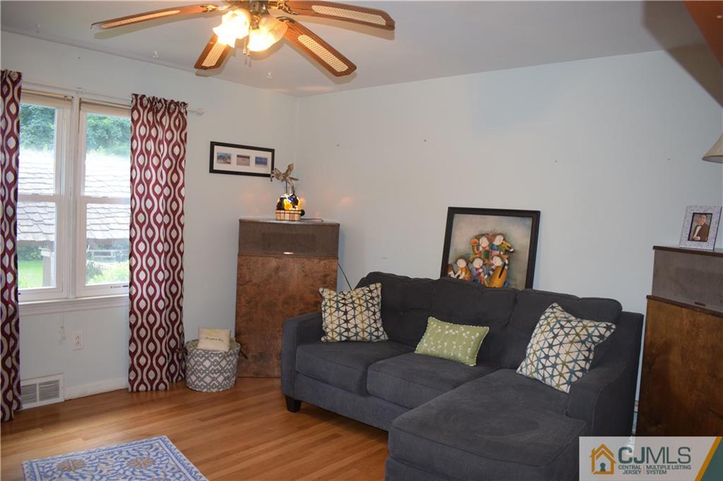 275 Friendship Road Cranbury, NJ 08512 - Photo 12 of 23 a living room with furniture and a window