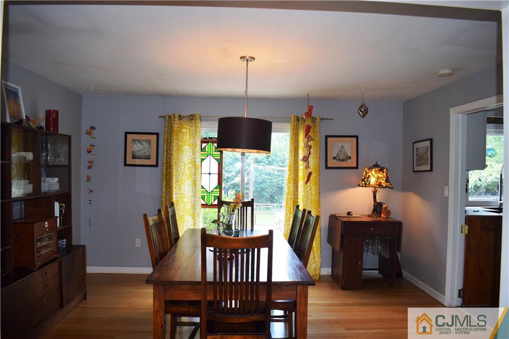 275 Friendship Road Cranbury, NJ 08512 - Photo 6 of 23 a view of a dining room with furniture window and wooden floor