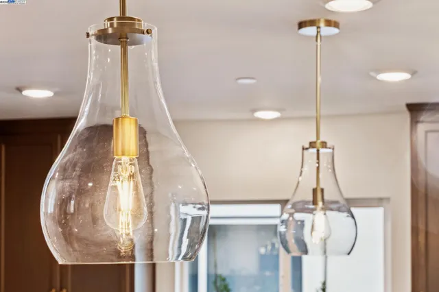 a view of a hallway with a room and a chandelier