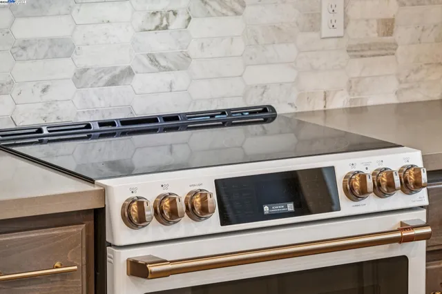 a close view of a stove and a microwave