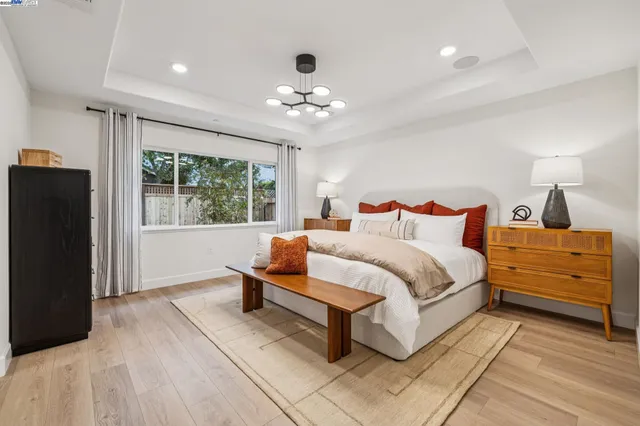 a bedroom with bed and window