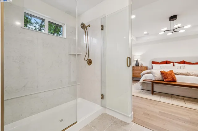 a bathroom with a bathtub and a shower