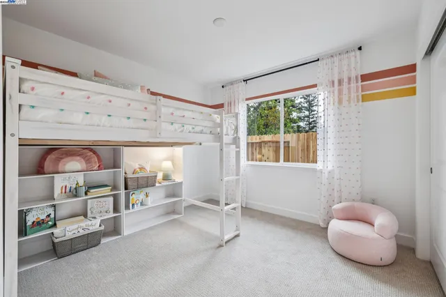 a view of room with window and air conditioner