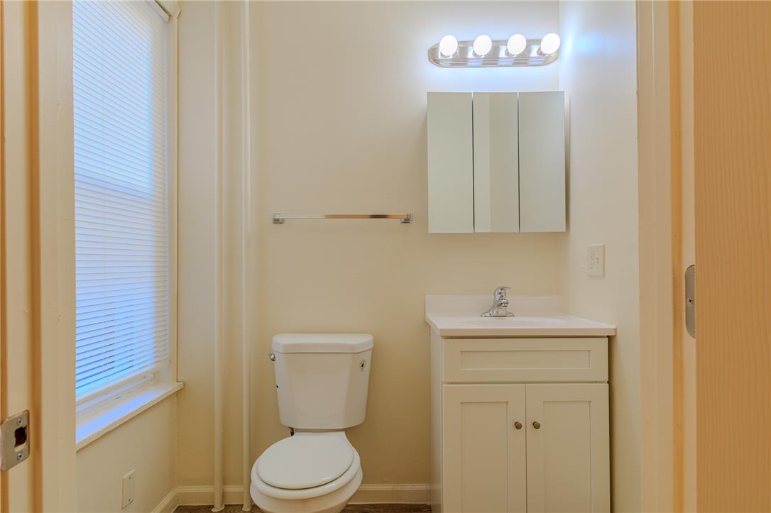 820 North 5th Street Allentown, PA 18102 - Photo 17 of 39 A well-lit powder room featuring a bright vanity and convenient toilet.