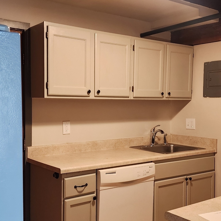 1 Samoset Avenue, Unit H Mansfield, MA 02048 - Photo 1 of 7 a kitchen with appliances cabinets and a sink