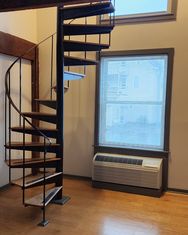 1 Samoset Avenue, Unit H Mansfield, MA 02048 - Photo 2 of 7 a view of staircase with a rug and a window