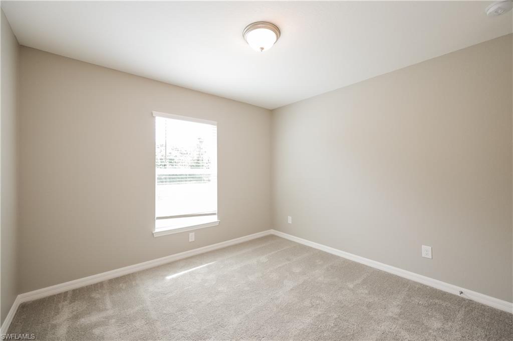 1218 Beaver Street East Lehigh Acres, FL 33974 - Photo 9 of 15 an empty room with a window