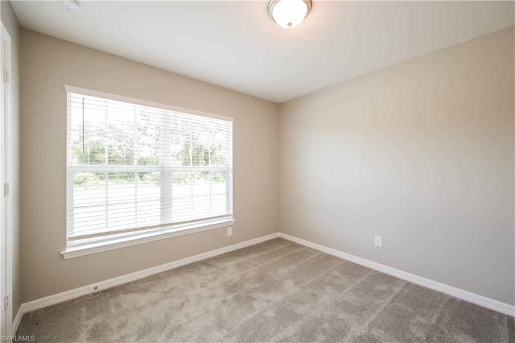 1218 Beaver Street East Lehigh Acres, FL 33974 - Photo 10 of 15 an empty room with a window