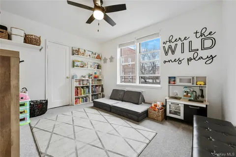 a living room with furniture and white walls