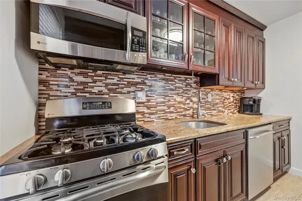 a kitchen with a stove and a microwave