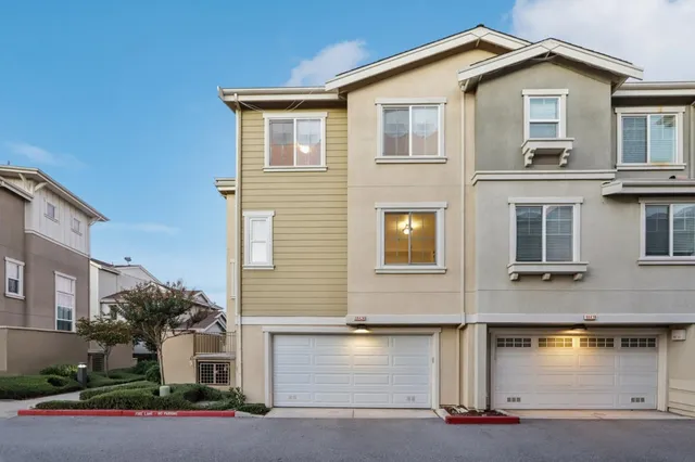 a front view of a house with garage
