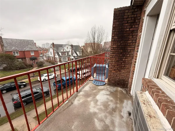 a view of balcony with furniture