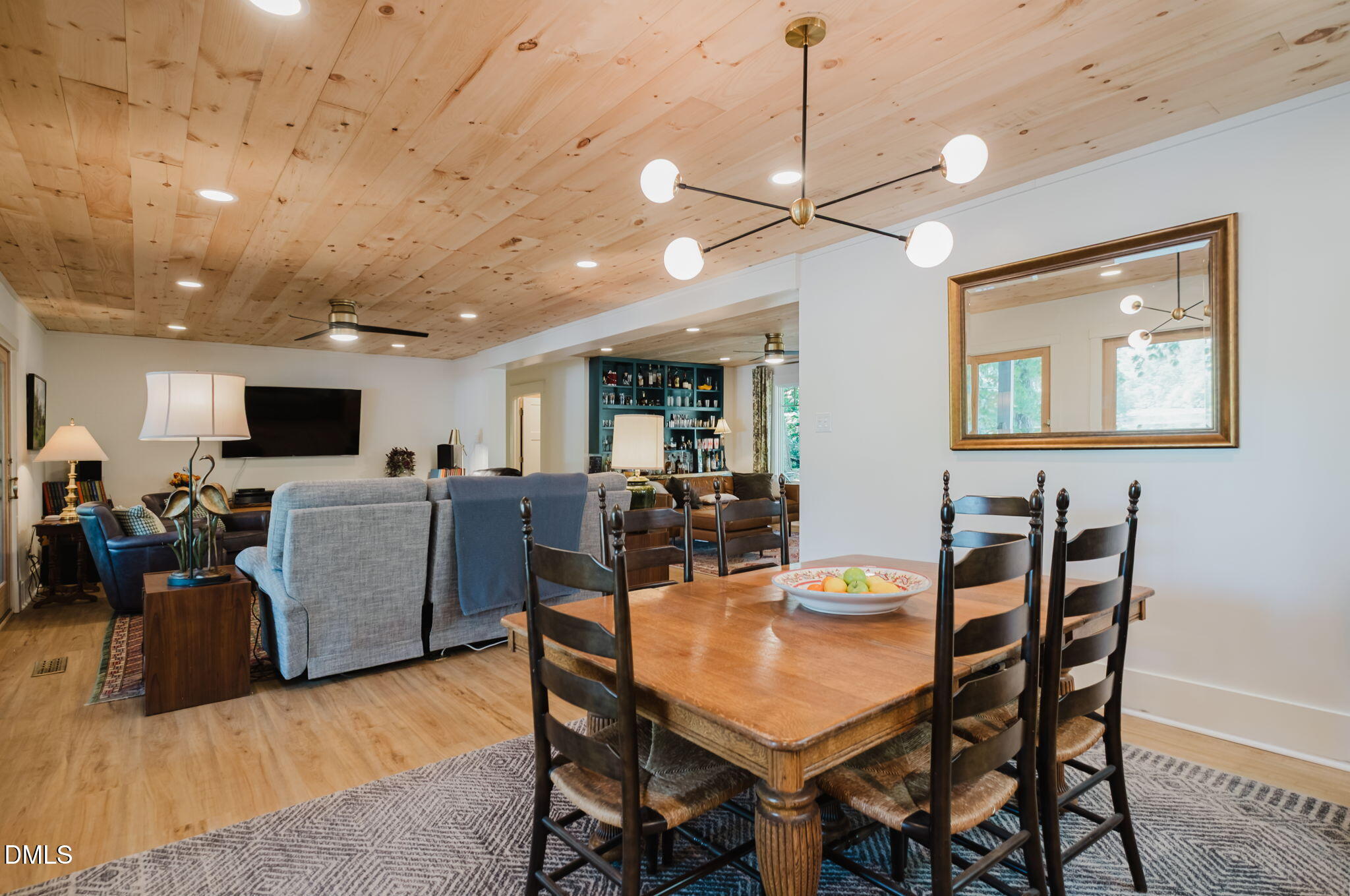 370 Robinson Ferry Road Macon, NC 27551 - Photo 25 of 85 a view of a dining room with furniture and a chandelier