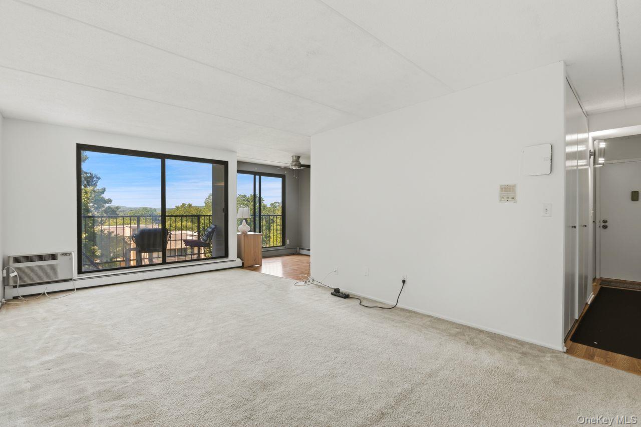 150 Overlook, Unit 5F Peekskill, NY 10566 - Photo 3 of 48 Freshly painted living with oversized glass sliding doors to a breathtaking panorama views.