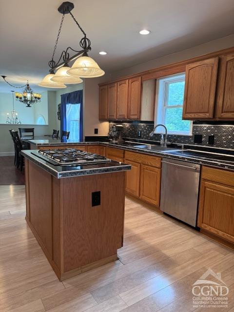 114 La Corte Road Catskill, NY 12414 - Photo 8 of 29 a kitchen with stainless steel appliances granite countertop a stove a sink dishwasher and a microwave oven with large wooden cabinets