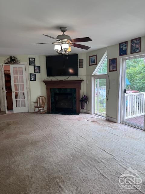 114 La Corte Road Catskill, NY 12414 - Photo 10 of 29 a view of a livingroom with a fireplace a chandelier and windows
