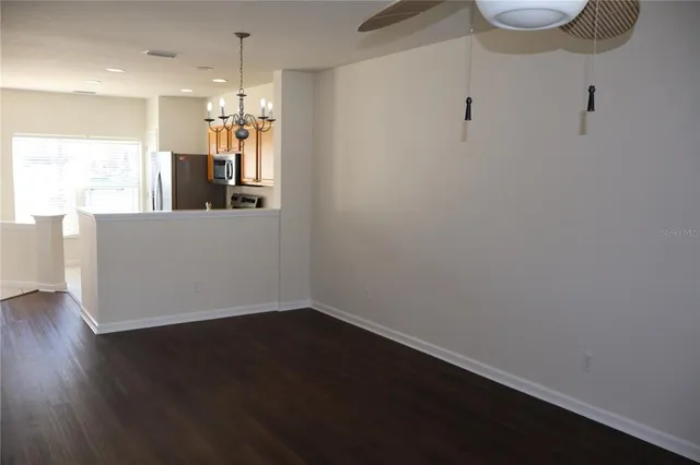a room with wooden floor and window