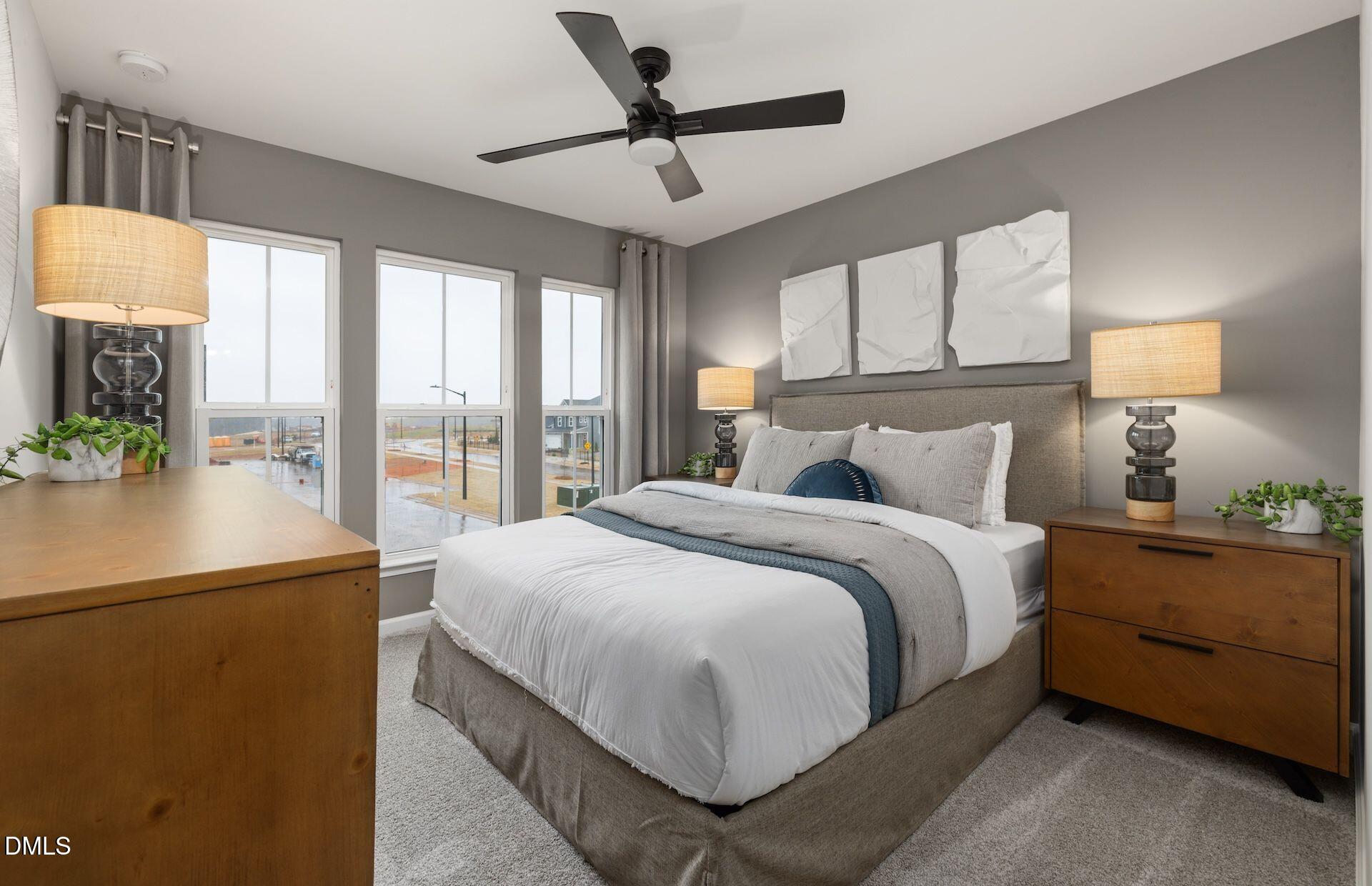 5003 Reader Way Durham, NC 27703 - Photo 16 of 30 a bedroom with a balcony a bed and a chandelier
