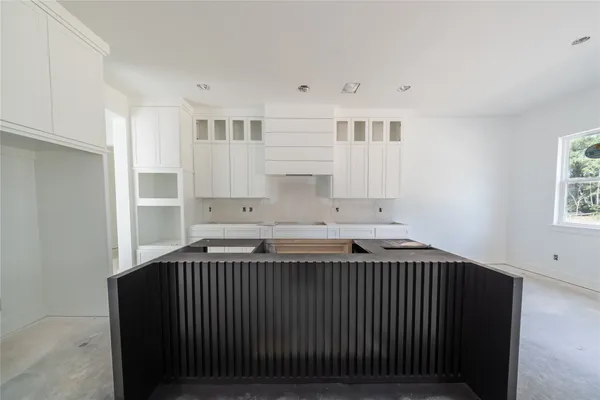 a kitchen with a sink and cabinets