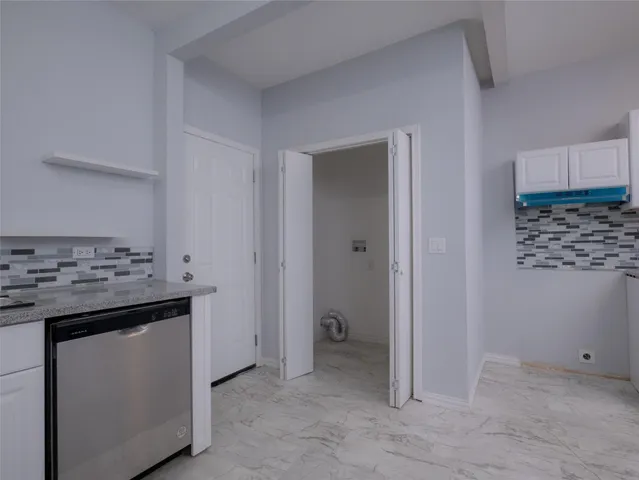 a kitchen with a stove and a refrigerator