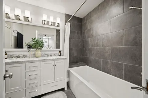 a living room with a couch and a table with wooden floor