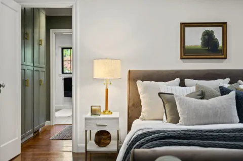 a bathroom with a sink a mirror and a shower