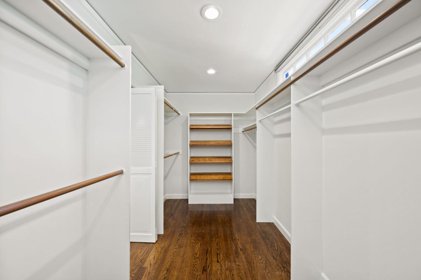 670 Edgewood Road San Mateo, CA 94402 - Photo 32 of 59 a view of walk in closet with wooden floor