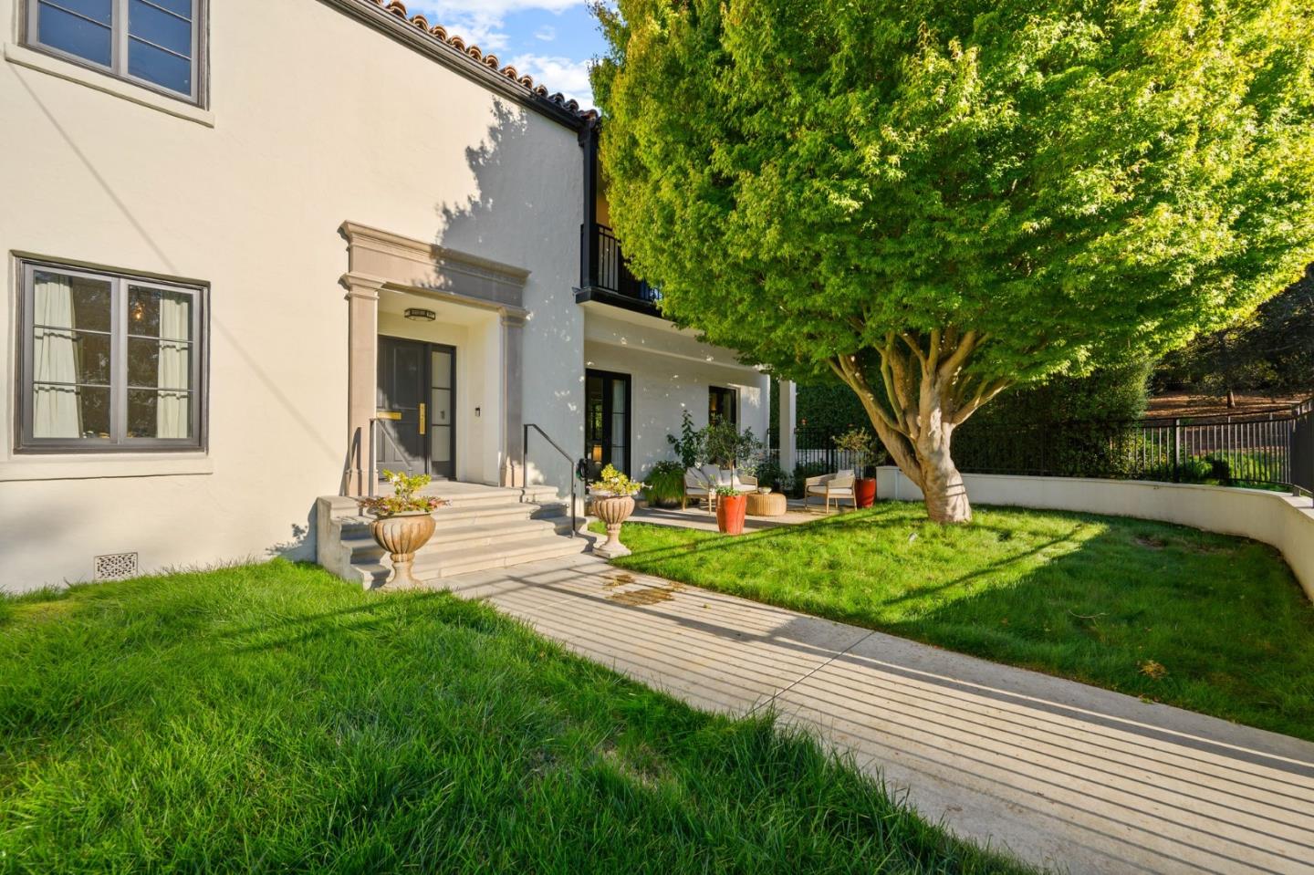 670 Edgewood Road San Mateo, CA 94402 - Photo 38 of 59 a front view of a house with garden and sitting area