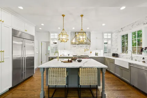 a kitchen with a table and chairs