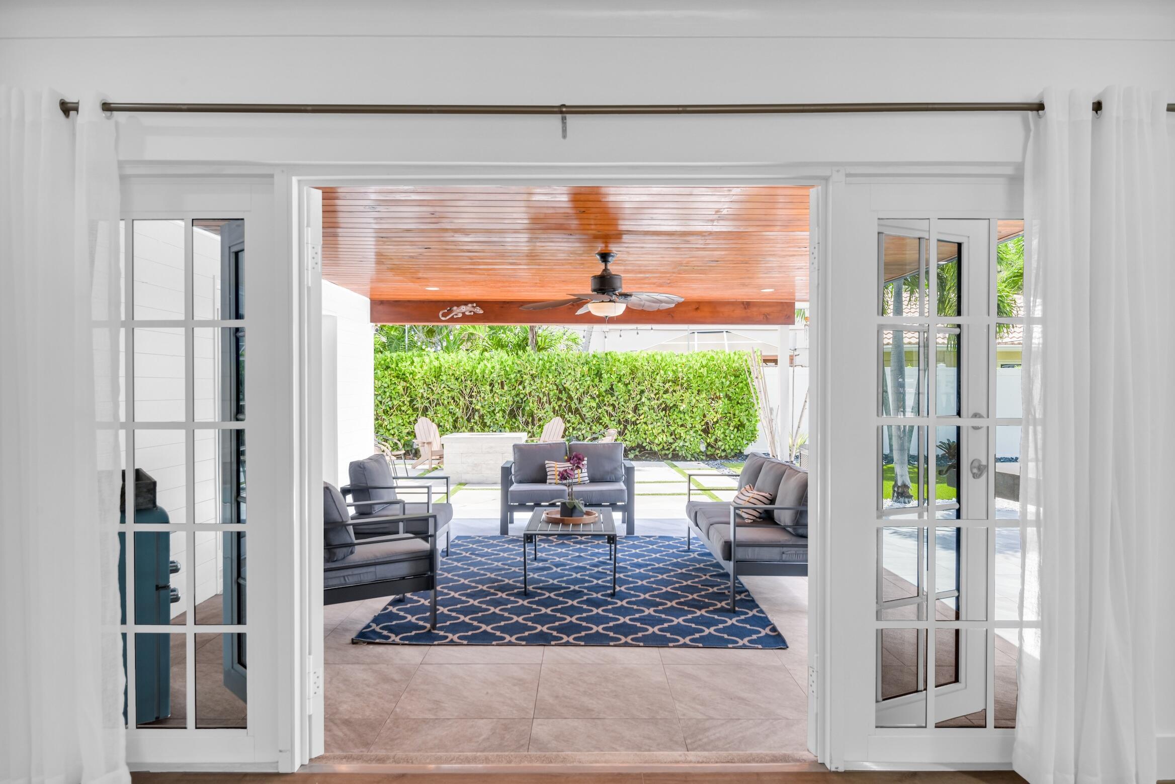 701 Appleby Street Boca Raton, FL 33487 - Photo 16 of 47 a outdoor living space with furniture and a garden view