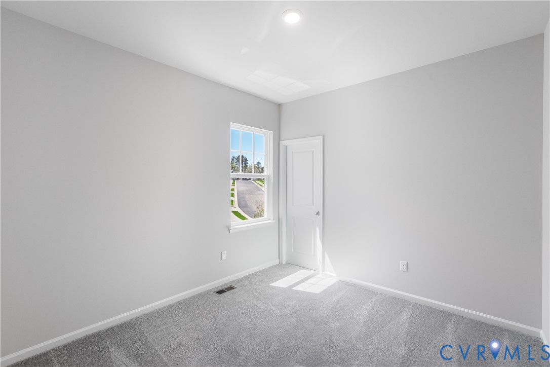 6616 Cassia Loop Moseley, VA 23120 - Photo 11 of 14 an empty room with windows