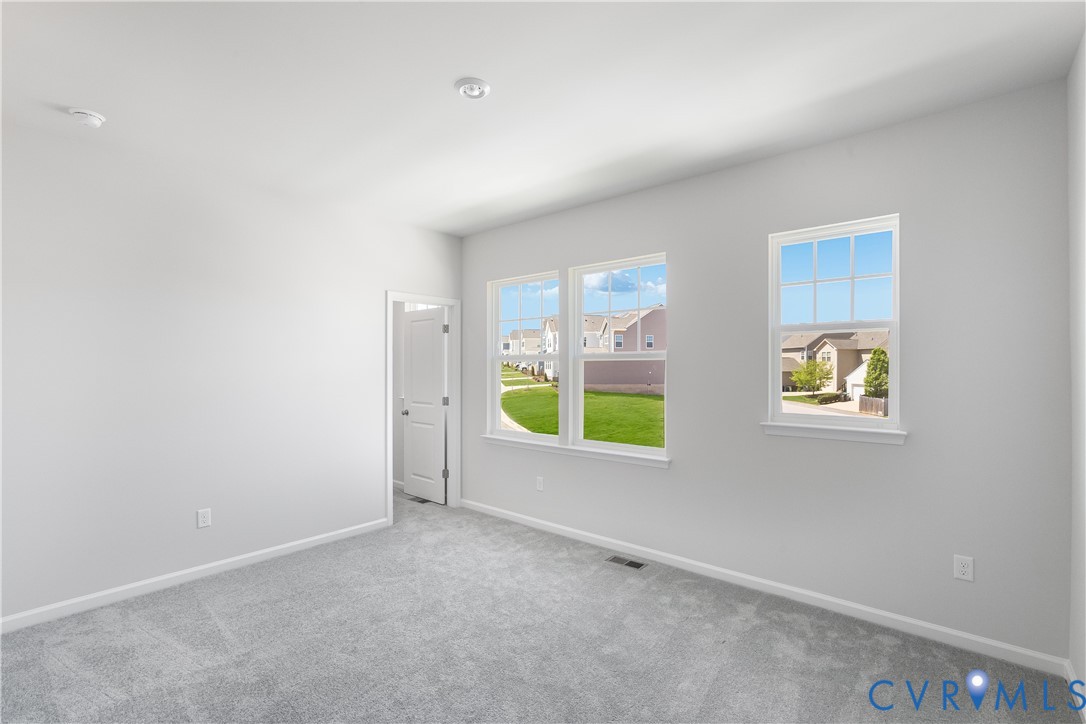 6616 Cassia Loop Moseley, VA 23120 - Photo 13 of 14 an empty room with windows