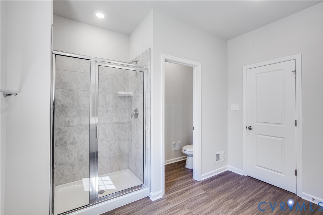 6616 Cassia Loop Moseley, VA 23120 - Photo 10 of 14 a bathroom with a shower and toilet