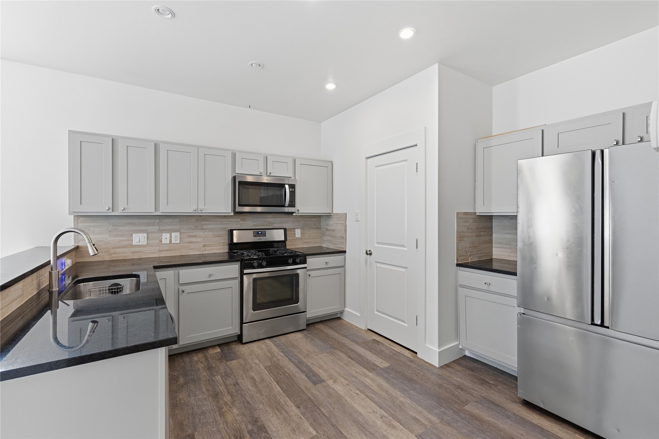 4124 Valley View Road, Unit 4A & 4B Austin, TX 78704 - Photo 25 of 40 A pristine modern kitchen features sleek stainless steel appliances and abundant cabinetry.