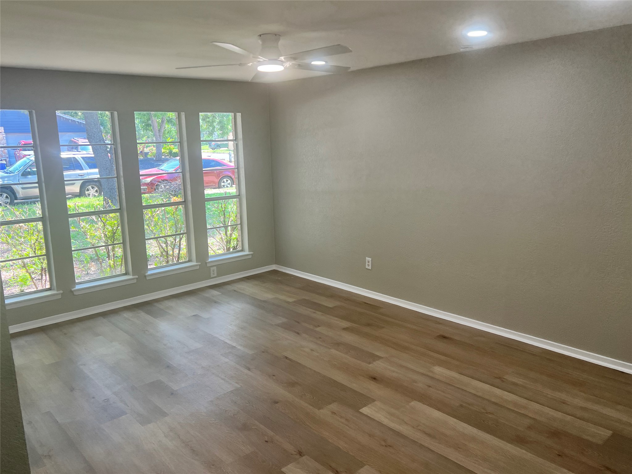 4620 Button Bend Road Austin, TX 78744 - Photo 4 of 22 A tranquil interior with ample natural illumination from multiple large windows.